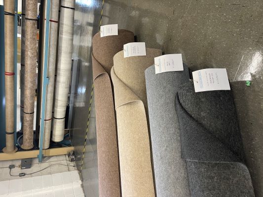 Rolls of Indoor/Outdoor carpeting in neutral shades